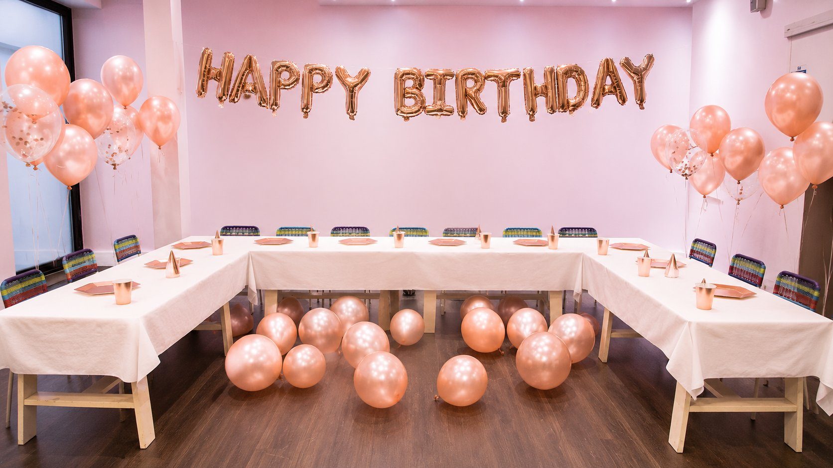 Birthday party room with rose-gold balloons at N20 KidsClub